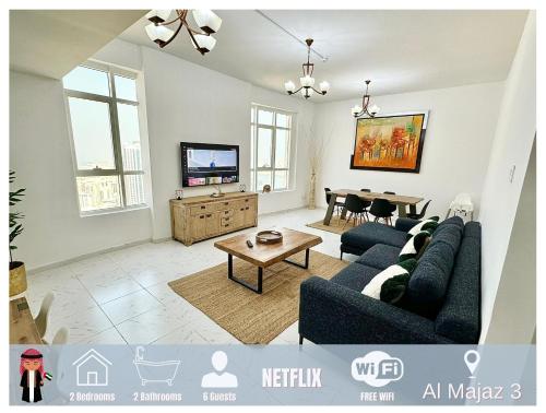 a living room with a couch and a table at Luxury Appartement Amazing View 130m2 Al Majaz 3 in Sharjah