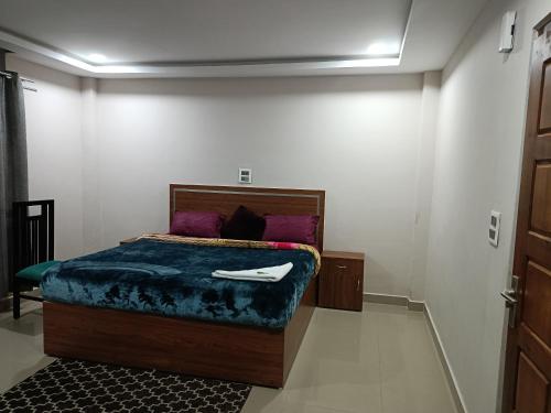 Ένα ή περισσότερα κρεβάτια σε δωμάτιο στο Hilsan Hotel