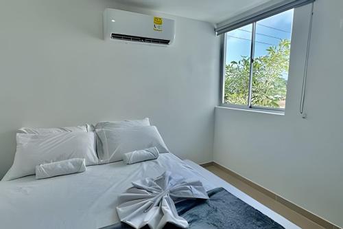 Uma cama ou camas num quarto em La Magnifica by Olamar Living