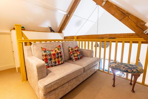 a living room with a couch and a table at Captains Lookout (Studio apartment) in Brecon