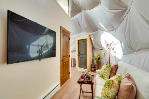 a living room with a white tent with a couch at Unique Escapes - Nature Lovers Geodome in Monticello