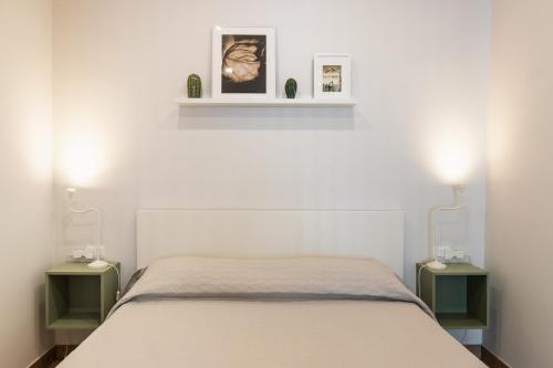 Ένα ή περισσότερα κρεβάτια σε δωμάτιο στο Cortile Siciliano Apartments