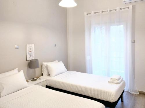 Krevet ili kreveti u jedinici u okviru objekta City Center Apartment with a Modern Breeze