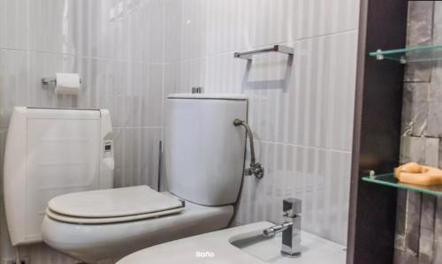 a bathroom with a toilet and a sink at AA la Nueva Fe in Valencia