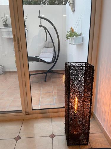 a glass door with a shower in a room at JVD Apartment in Dubai