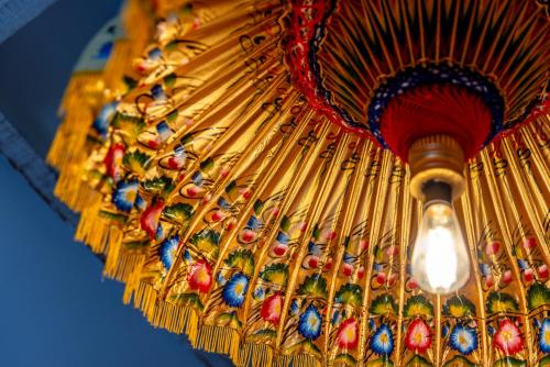 a close up of a gold umbrella at Luxurious, Fabulous, Fun, Contemporary Suite in Retreat Centre in Salisbury