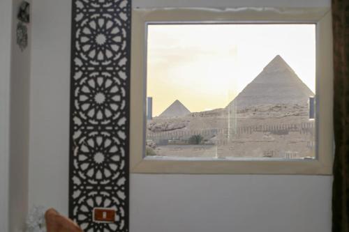 a window with a view of the pyramids at pyramids light show in Cairo
