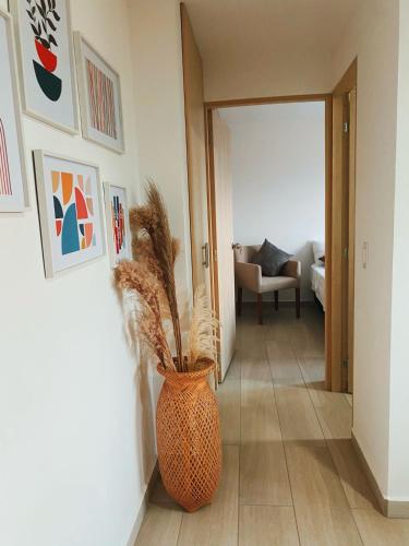 a hallway with a vase with a plant in it at Loma Rent Home Guatape in Guatapé