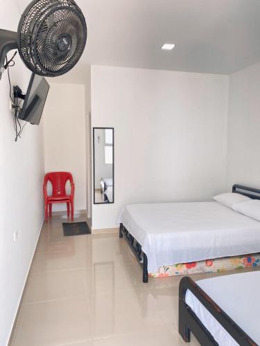 Katil atau katil-katil dalam bilik di Habitaciones coveñas