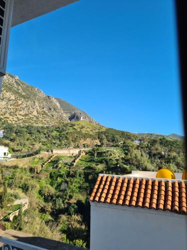 a view of a mountain from a house at Maison d'hôte Bousaid in Chefchaouene