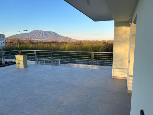 a large patio with a view of a mountain at La casa dei Coloni in Nola