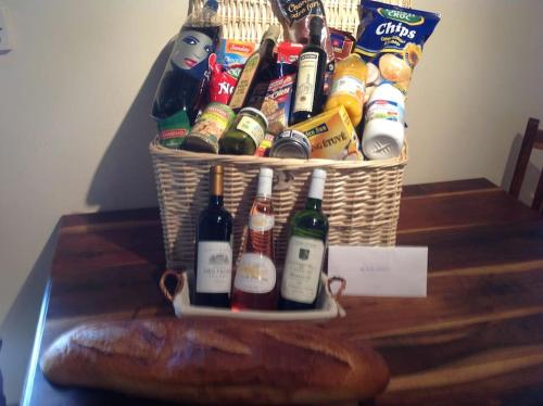 a basket of beer and chips on a table at Magnificent 18th Century, 5 Star Luxury Spa in Melleray-la-Vallée