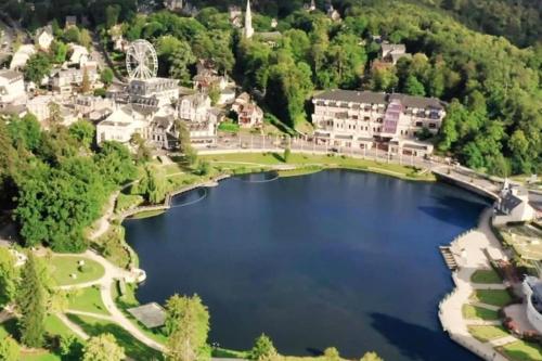 an aerial view of a lake in a town at Magnificent 18th Century, 5 Star Luxury Spa in Melleray-la-Vallée