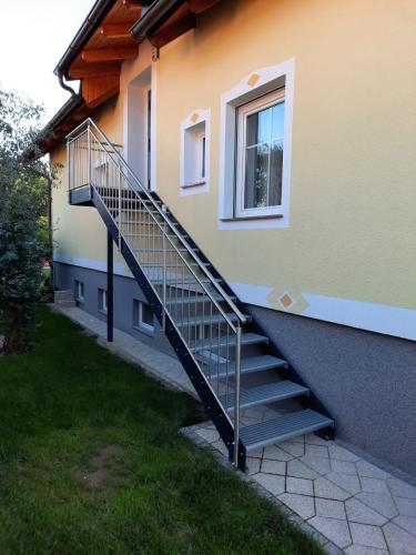 a staircase leading up to a building with a window at Apartment Martin in Merkendorf