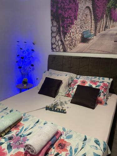 a bed with two pillows on top of it at Villa Zigana in Mostar