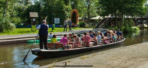 a group of people on a boat in the water at Ferienwohnung Sonnenberg Dahmeblick in Märkisch Buchholz