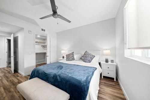 a white bedroom with a bed and a ceiling fan at Exclusive property in the heart of marina del rey in Los Angeles