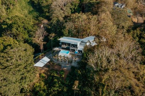 an overhead view of a house in the forest at Vida Palace in Jacó