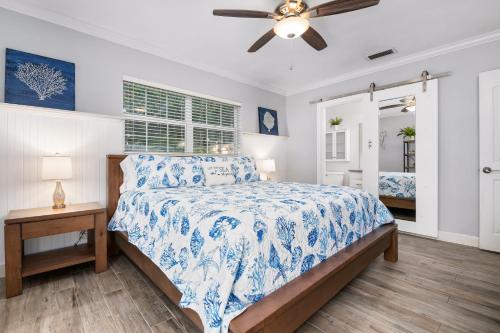 A bed or beds in a room at Nautical Escape! Private pool home with a tropical backyard oasis!