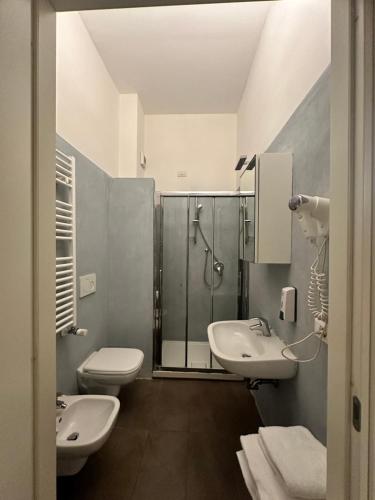 a bathroom with two sinks and a shower at Villa Giovanna Citylife Milano in Milan