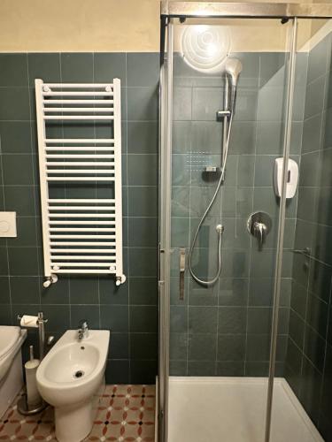 a bathroom with a shower and a toilet and a sink at Villa Giovanna Citylife Milano in Milan