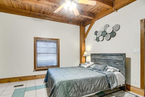 a bedroom with a bed and a wooden ceiling at Angleton Vacation Rental with On-Site Lake Access! in Angleton