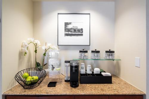 a kitchen counter with a coffee maker on a counter at Villa Graziadio Executive Center at Pepperdine University in Malibu