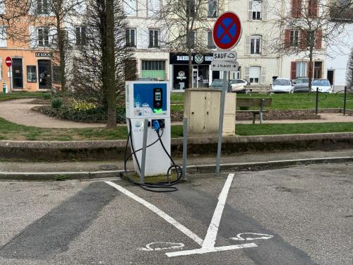 a gas pump sitting in the middle of a street at Jeanne d''Arc by Carl-Emilie in Épinal