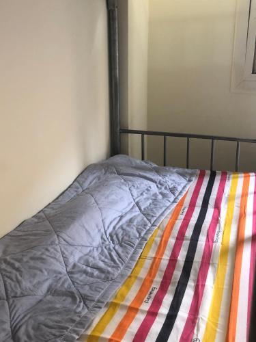 Säng eller sängar i ett rum på Welcome Dubai Hostel