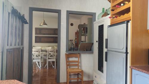 a kitchen with a counter and a dining room at Blanca Martín in Trevélez