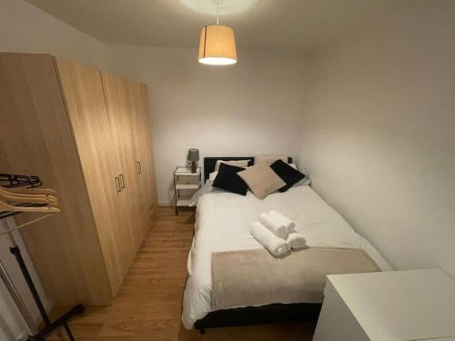 a bedroom with a bed with white towels on it at Marco Island apartment in Nottingham