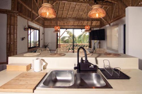 a kitchen with a sink and a counter top at Guaduas de Jade Casa campestre in La Mesa