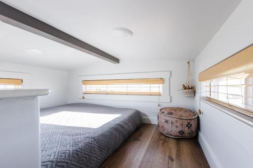 a bedroom with a bed and a window at Sun Catcher in Apple Valley