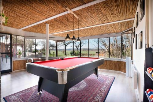 a billiard room with a pool table in a house at Natura Apartman Tiszafüred in Tiszafüred