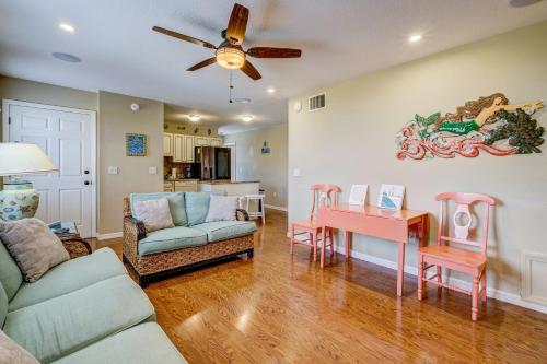 a living room with a couch and a table at Sea Site Retreat Unit B! Great attractions nearby! Short walk to the beach! in Bradenton Beach