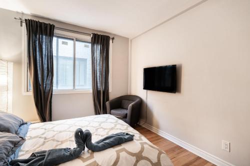 Cama ou camas em um quarto em Grand appartement 4 chambres - 335