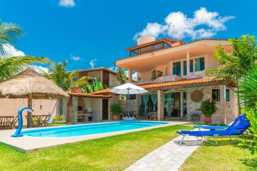 an image of a villa with a swimming pool at Paraíso de Tabuba - casa de aluguel por temporada - 32km de Maceió-AL - Pé na areia - 24h de Frente para o mar in Barra de Santo Antônio