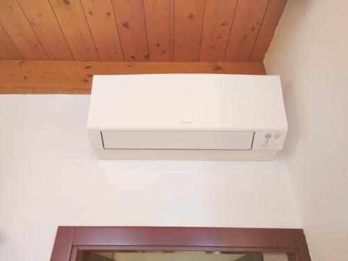 a white router hanging from a ceiling at CASA MARGHERITA Basilica view & Terrace in Vicenza