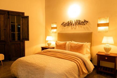 Letto o letti in una camera di Santa Lucía Casa Hotel