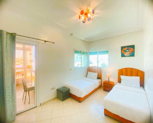 Llit o llits en una habitació de Cosy greeny near PAUL harhoura