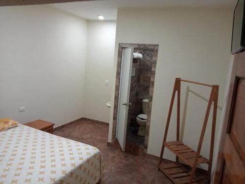 Postel nebo postele na pokoji v ubytování Hotel Hacienda Huasteca