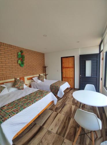 Ein Bett oder Betten in einem Zimmer der Unterkunft La Cabaña Miraflores