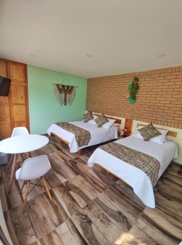 Ein Bett oder Betten in einem Zimmer der Unterkunft La Cabaña Miraflores