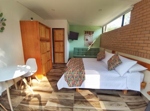 Ein Bett oder Betten in einem Zimmer der Unterkunft La Cabaña Miraflores