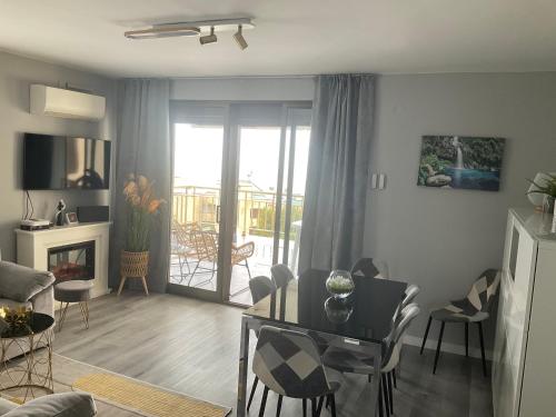 a living room with a table and a dining room at Appartement chez François in Salou
