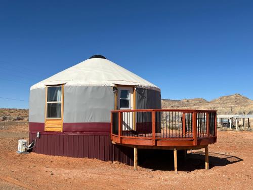 a yurt sitting in the middle of the desert at The Lotus Yurt at Nomad Yurts, Lake Powell in Big Water