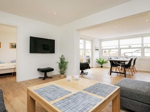 a living room with a couch and a table at 4 person holiday home in Skagen in Skagen