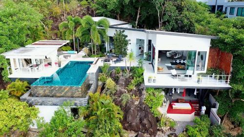 an aerial view of a house with a swimming pool at VILLA TSAY - Nature, Privacy, Elegance in Haad Yao