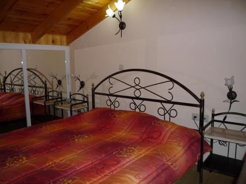 a bedroom with two beds and two tables in it at Akrogiali in Míloi