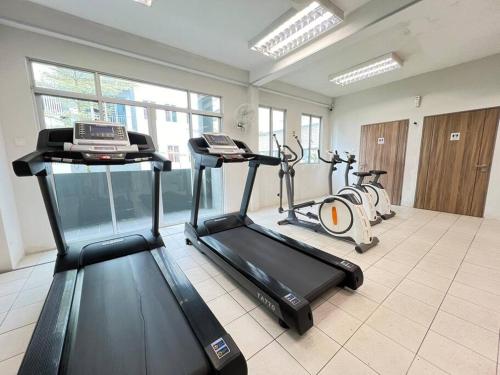 a gym with two exercise bikes in a room at AJ Homestay Near Kuching Airport in Kuching